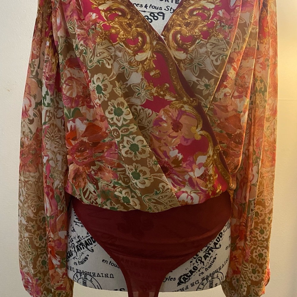 Blouse / bodysuit with lining and front snap closure.